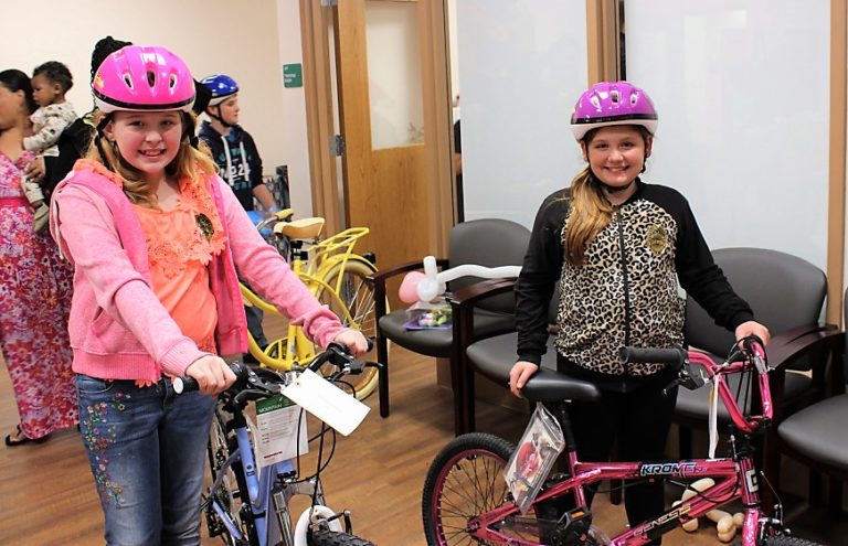 Beaming young faces tell heartwarming story of Leesburg police bike giveaway