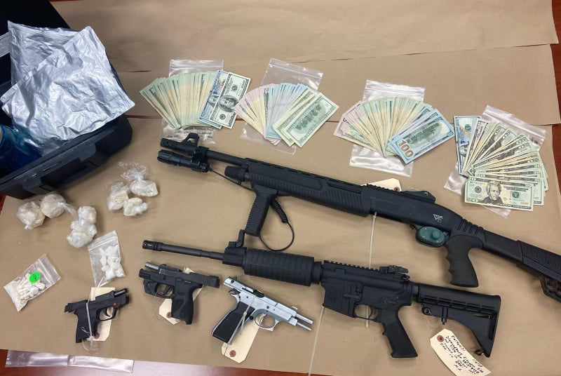 Drugs weapons and cash were seized Wednesday during a raid at the home of Brian Lockhart in Leesburg