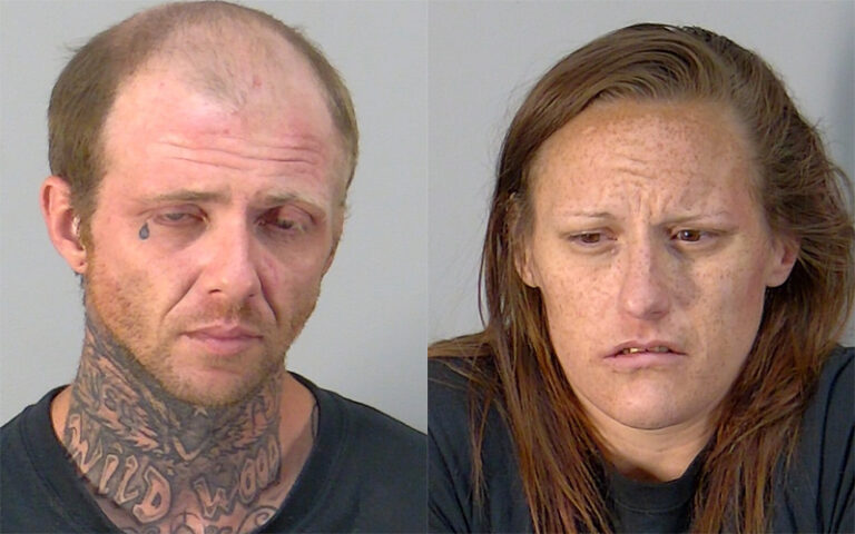 Pair arrested after search prompted by burned-out headlight