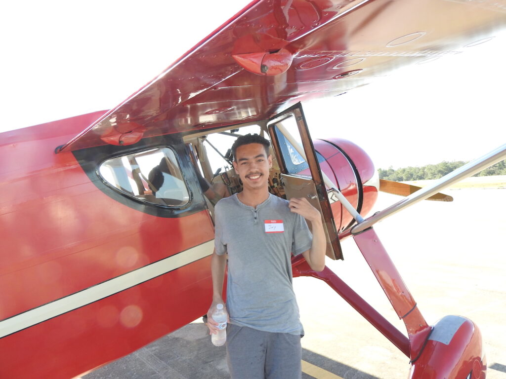 Young Eagle Jay Almanzar grins from ear to ear after his flight in Mark Peebles 1946 Fairchild 24