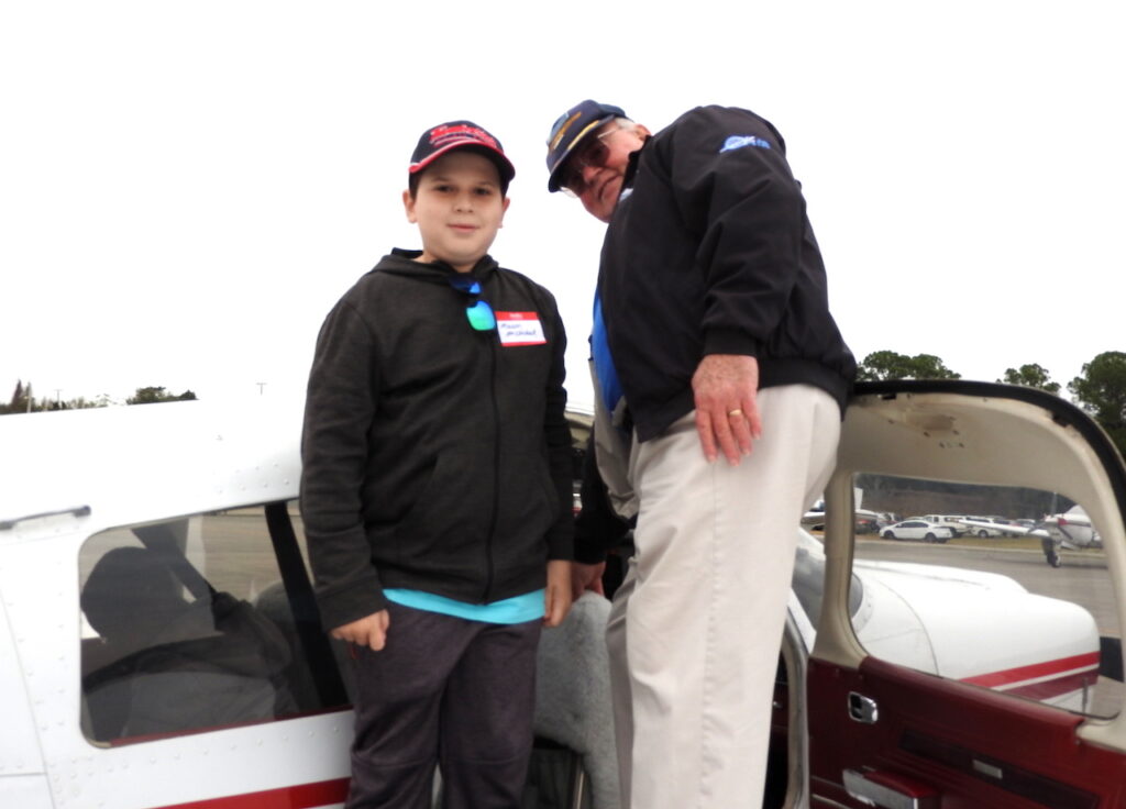 Young Eagle Mason McClintock is about to takeoff with EAA Chapter 534 pilot Lee Helfer.