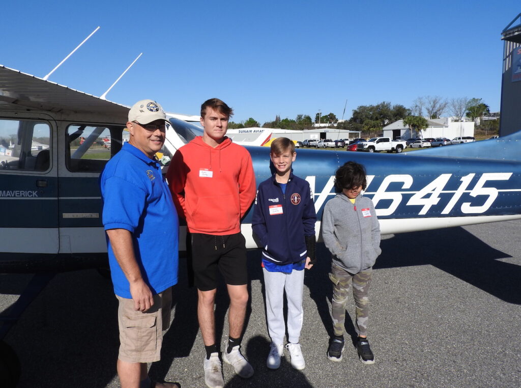 EAA Chapter 534 pilot and chapter President Mike Hage and his Young Eagle crew L to R Ryan Cary Daniel Swartz and Miguel Cespedes.