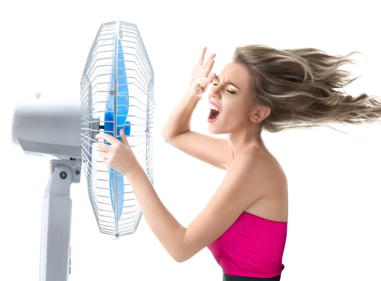 Young woman with cooler fan