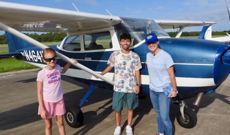 Rosie Rivera, right, takes her first two Young Eagles for their introductory flight. They are Amalie Weaver and Gabriel Carrasquillo.