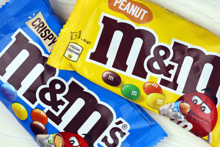 KHARKIV, UKRAINE JANUARY 2, 2021 M and Ms colorful button shaped chocolate candies. Multi colored chocolates each of which has the letter m printed in lower case in white