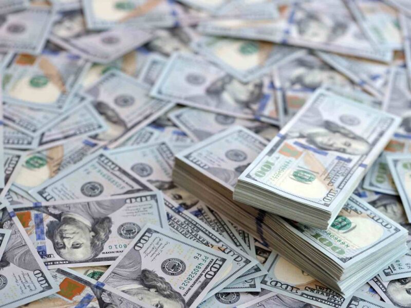 Hundred dollar bills in a pile